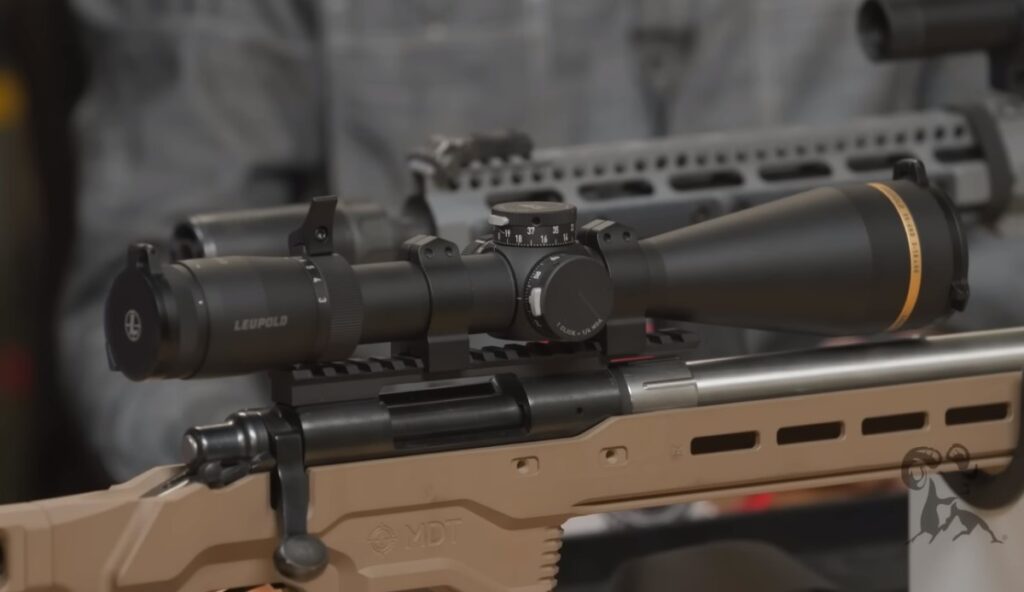Rifle scope mounting